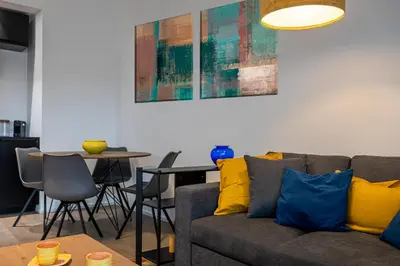 a living room with a couch and a table at Suite close to Vatican City - Ingresso Spa in Rome