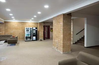 a lobby with couches and a brick wall at Suite close to Vatican City - Ingresso Spa in Rome