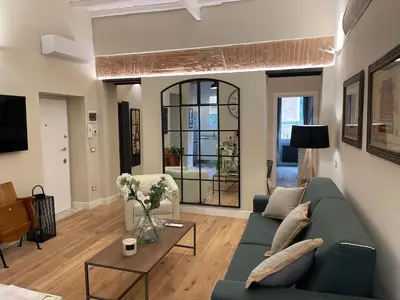 a living room with a couch and a table at THE BREAK - Piazza di Spagna Maison Deluxe Terrace in Rome