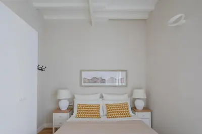 a bedroom with a bed with orange and white pillows at THE BREAK - Piazza di Spagna Maison Deluxe Terrace in Rome