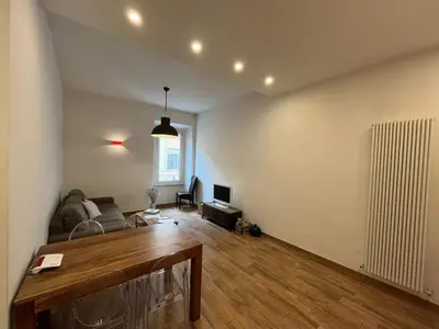 a living room with a couch and a table at La Dolce Vita - Luxury Colosseum Boutique Apartment in Rome