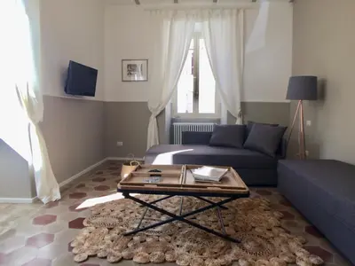 a living room with a couch and a coffee table at Roma Testaccio - Volta 45 apartment in Rome