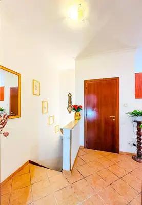 a room with a door and a counter and a table at Giardino degli Aranci Lulus Home in Rome
