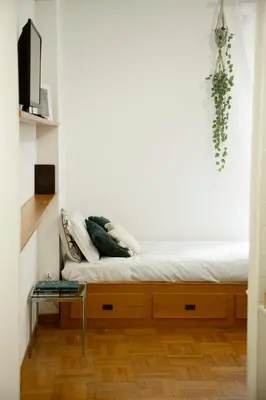 a room with a bed and a table at Shabby Roman Studio- ai fori Imperiali in Rome