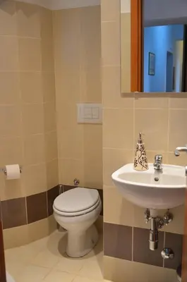 a bathroom with a toilet and a sink at Hostel Castello Maggiore in Rome