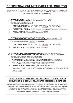 a stack ofritten documents with the names of different languages at Hostel Castello Maggiore in Rome