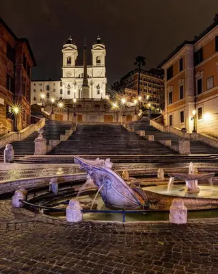 a building with a statue of a fish in the water at Dolcevita’s House in Rome