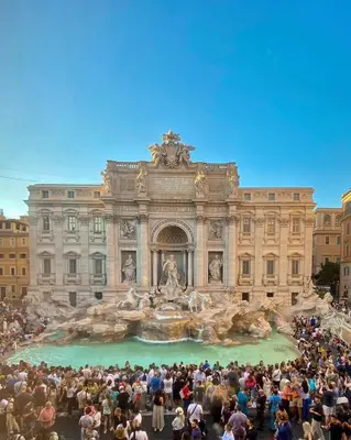 a large crowd of people standing in front of a building at Dolcevita’s House in Rome
