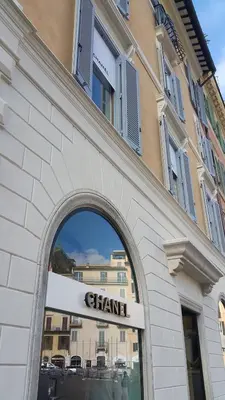 a chandan sign in front of a building at Relais Bocca di Leone in Rome