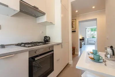 a kitchen with a stove and a counter top at Trastevere at heart in Rome