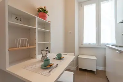 a kitchen with a table with two cups on it at Trastevere at heart in Rome