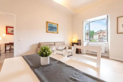 a living room with a couch and a table at Trastevere at heart in Rome