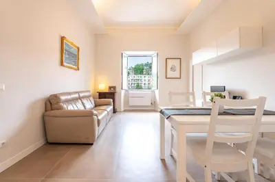 a living room with a table and a couch at Trastevere at heart in Rome