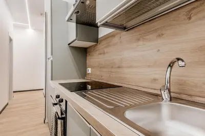 a kitchen with a sink and a stove at Casa Roma B&B in Rome
