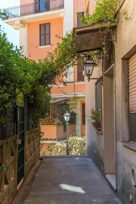 an alley in an apartment complex with a building at Studio in Trastevere Village in Rome