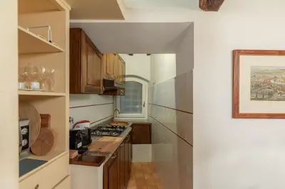 a kitchen with a sink and a stove top oven at iFlat Comfy Apartament in Campo de' Fiori in Rome