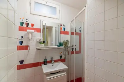 a bathroom with a sink and a mirror at iFlat Comfy Apartament in Campo de' Fiori in Rome