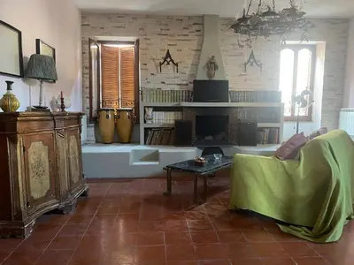 a living room with a couch and a fireplace at CASA PANIERI in Rome