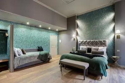 a bedroom with two beds and a large green wall at Heritage Miracle Suite in Rome