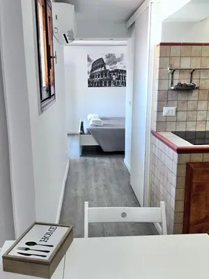 a small room with a kitchen and a bedroom at Magenta Terrione 2 in Rome