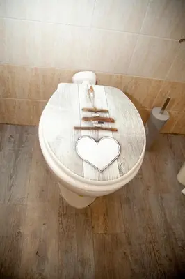 a toilet with a heart drawn on the top of it at Magenta Terrione 2 in Rome
