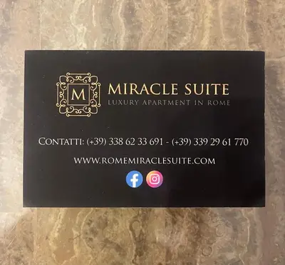 a black business card for a private suite at Corso Miracle Suite in Rome
