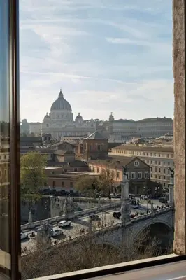 a view of a city from a window at La Torre di Castel Sant'Angelo in Rome