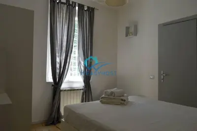 a bedroom with a bed and a window at Pigneto Modern Apartment in Rome