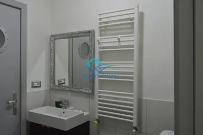 a bathroom with a sink and a mirror at Pigneto Modern Apartment in Rome