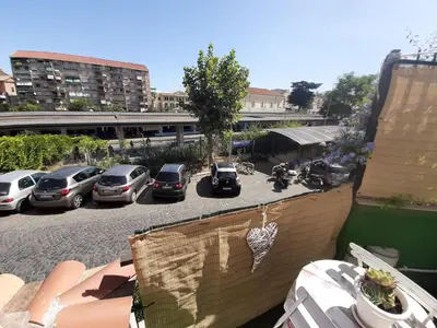 a group of cars parked in a parking lot at San Pietro Shabby Chic Apartment in Rome