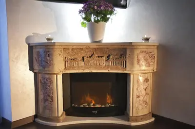 a stone fireplace with a fire in it at San Pietro Shabby Chic Apartment in Rome