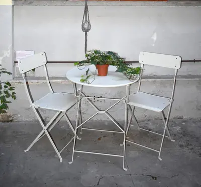 two chairs and a table with a potted plant on it at ACasaMiaSanPietro in Rome