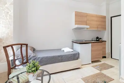two twin beds in a room with a window at BARONE HOUSE in Rome