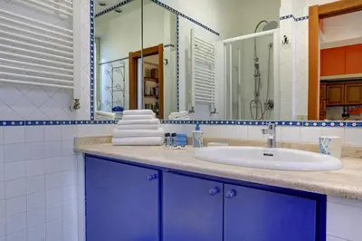 a bathroom with a sink and a mirror at Colosseo Residenza Sette Sale in Rome