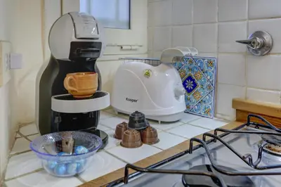 a kitchen counter with a mixer on a counter top at Colosseo Residenza Sette Sale in Rome