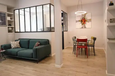 a living room with a couch and a table at Suite RHome In Vatican in Rome