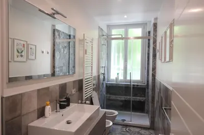 a bathroom with a sink and a toilet and a shower at Suite RHome In Vatican in Rome