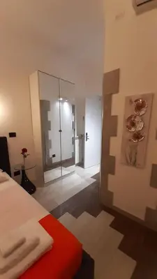 a room with a bed and a glass shower at HARMONY RELAX HYDROMASSAGE SAUNA AT THE VATICAN MUSEUMS in Rome