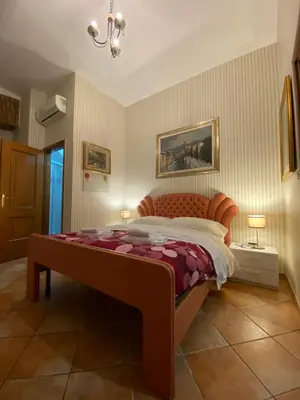 a bedroom with a large bed in a room at apartment vittorio Emanuele in Rome