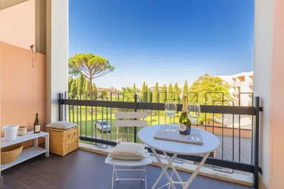 a table and two chairs on a balcony with a view at Laura's Rooms a due passi dal Vaticano - RIONI DI ROMA in Rome