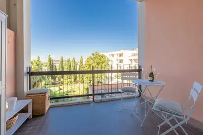 a room with a balcony with a table and chairs at Laura's Rooms a due passi dal Vaticano - RIONI DI ROMA in Rome