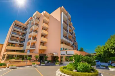 a large building with a parking lot in front of it at Laura's Rooms a due passi dal Vaticano - RIONI DI ROMA in Rome