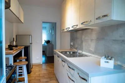 a kitchen with a sink and a counter top at Appartamento Appio Latino in Rome