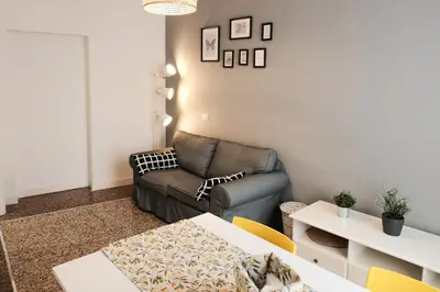 a living room with a couch and a table at Family apartment near Vatican Museum in Rome