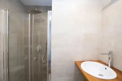 a bathroom with a sink and a shower at Domus Cordara - Splendido appartamento nel verde in Rome