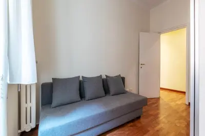 a living room with a couch in a room at GuestHost - Rione Prati Comfy Apartment in Rome