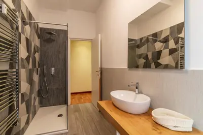 a bathroom with a sink and a shower at GuestHost - Rione Prati Comfy Apartment in Rome