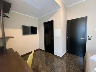 a bedroom with a bed with two towels on it at Viminale Domus in Rome