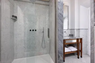 a shower with a glass door in a bathroom at TB Place Roma in Rome