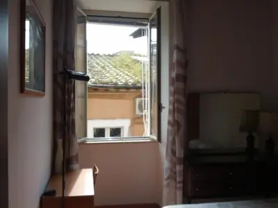 a window in a room with a view of a building at Casa Vacanze Yuli in Rome